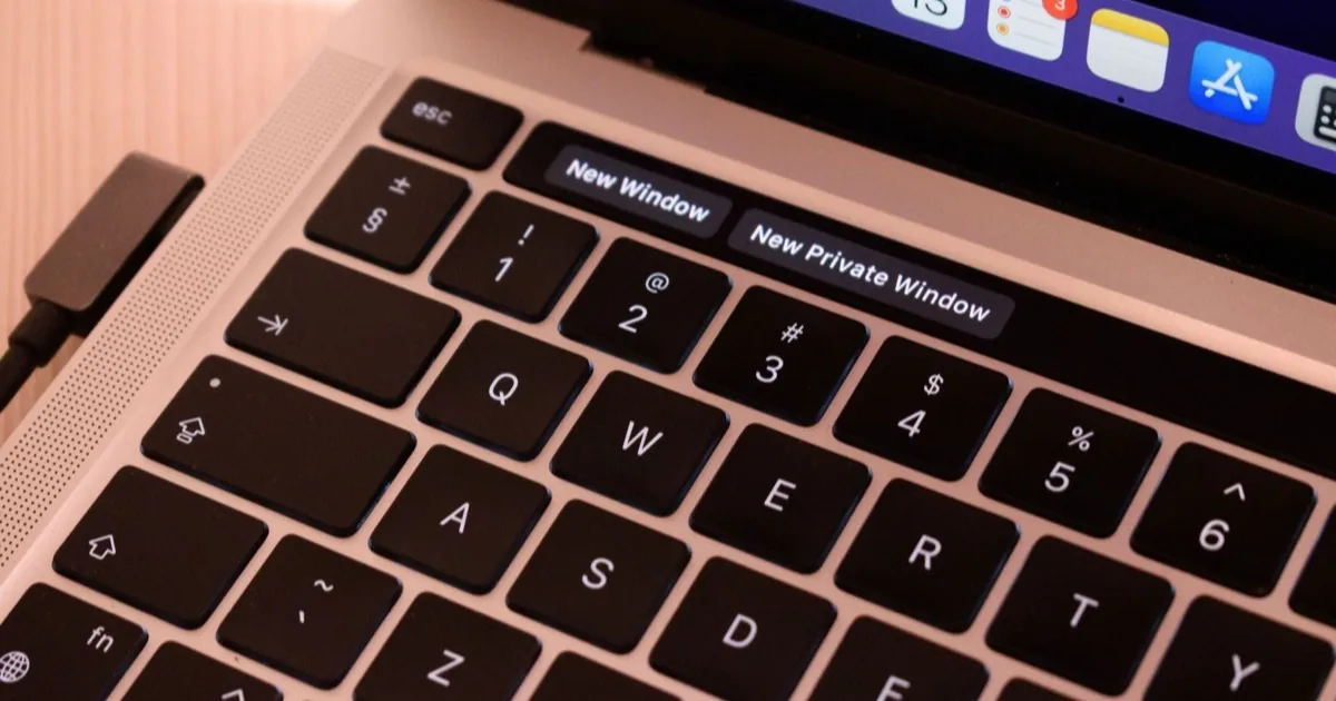 Close-up of a laptop keyboard showing browser window shortcuts.